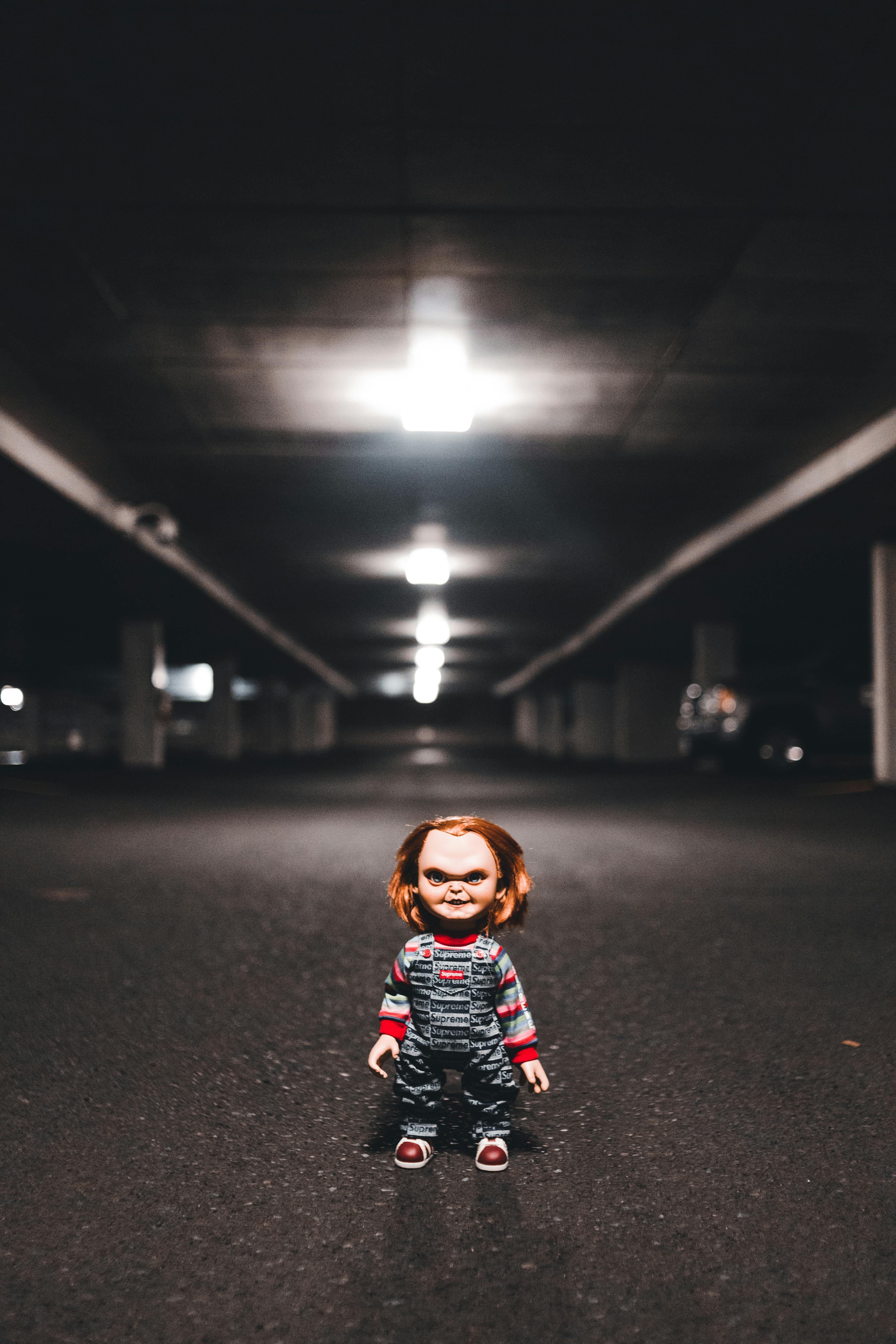 chucky doll on dark underground parking