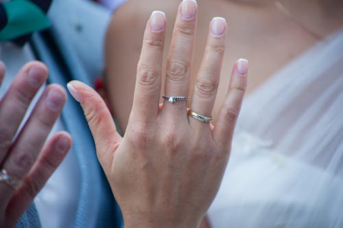 Person Wearing Silver Rings