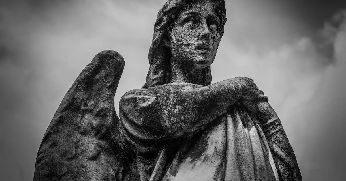Woman With Wings Statue Grayscale Photo