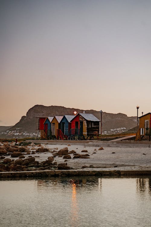 Colorful Beach Huts at Dusk 