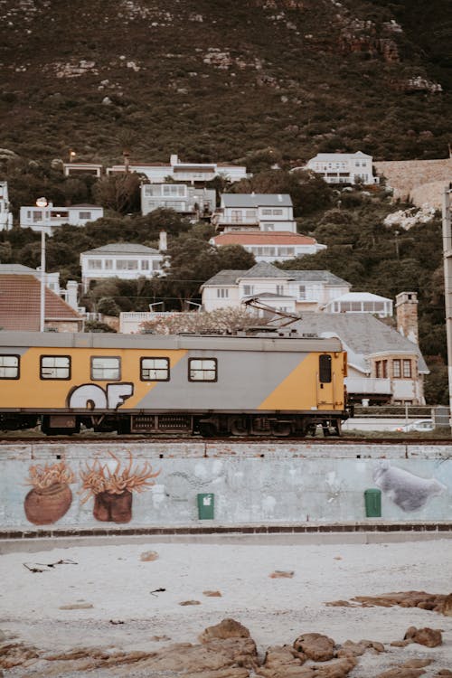 Yellow and Gray Train on Rail Tracks