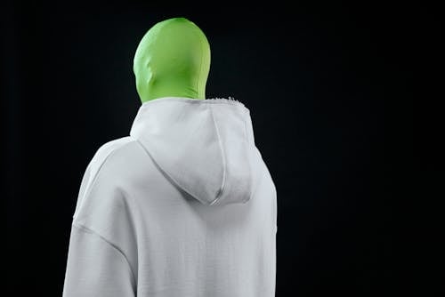 A Person in a Green Screen Suit Wearing a Hoodie Sweater