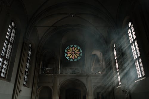Free Dark Cathedral Interior and Light from the Windows Stock Photo