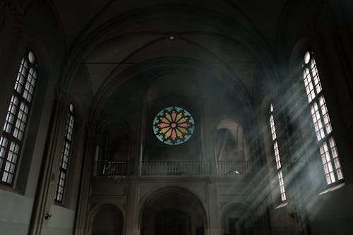 Free Dark Cathedral Interior and Light from the Windows Stock Photo