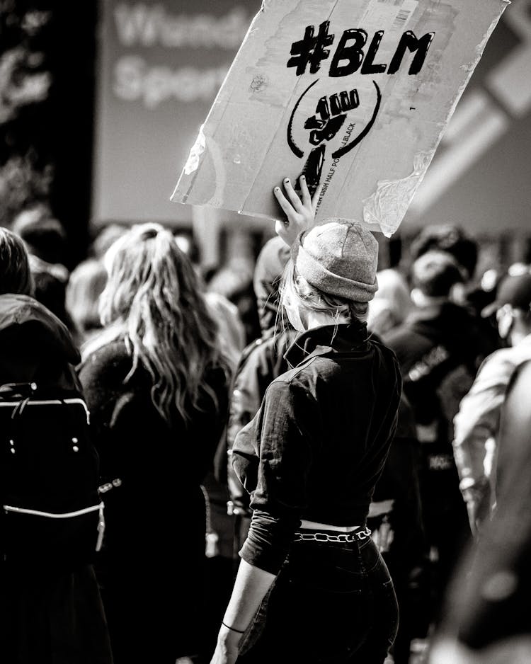 People Raising Poster On Protest