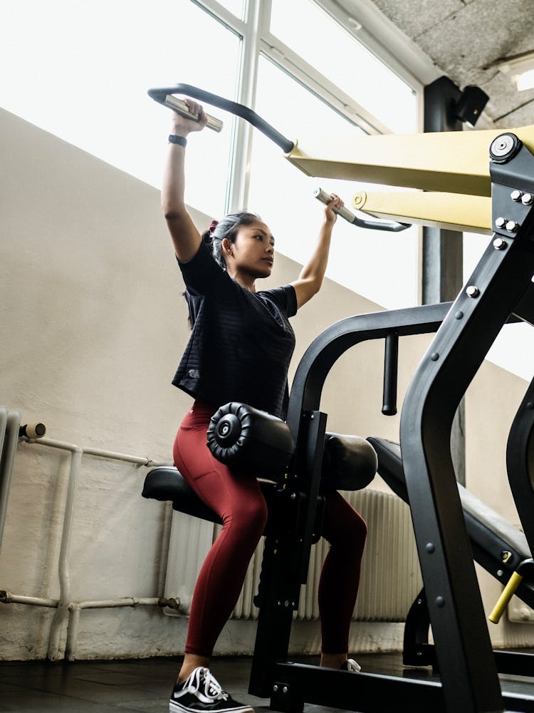 Photo Of A Woman Exercising In A Gym 