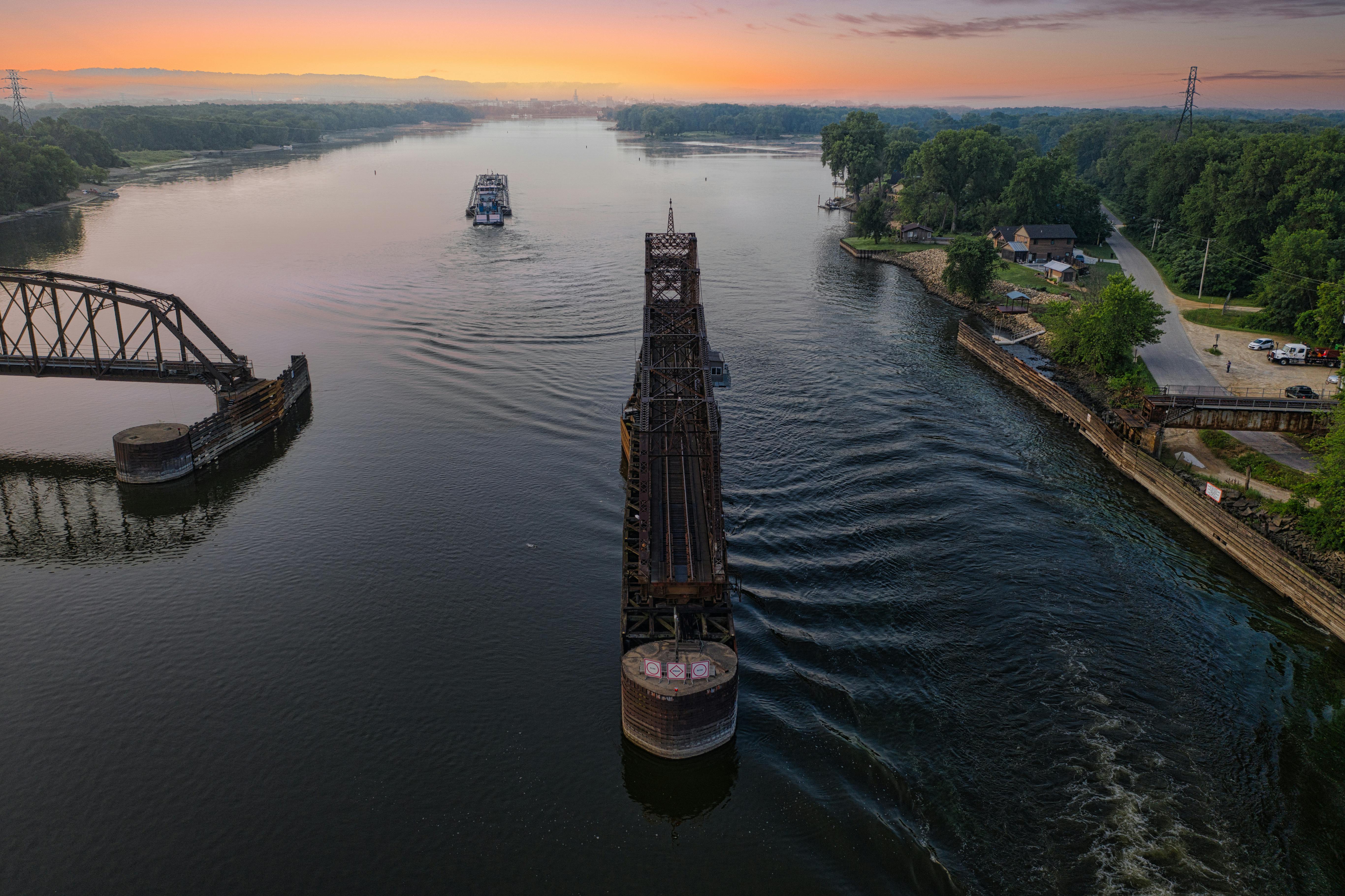 A stunning aerial view of the Mississippi River swing bridge in La Crescent, MN at sunset.