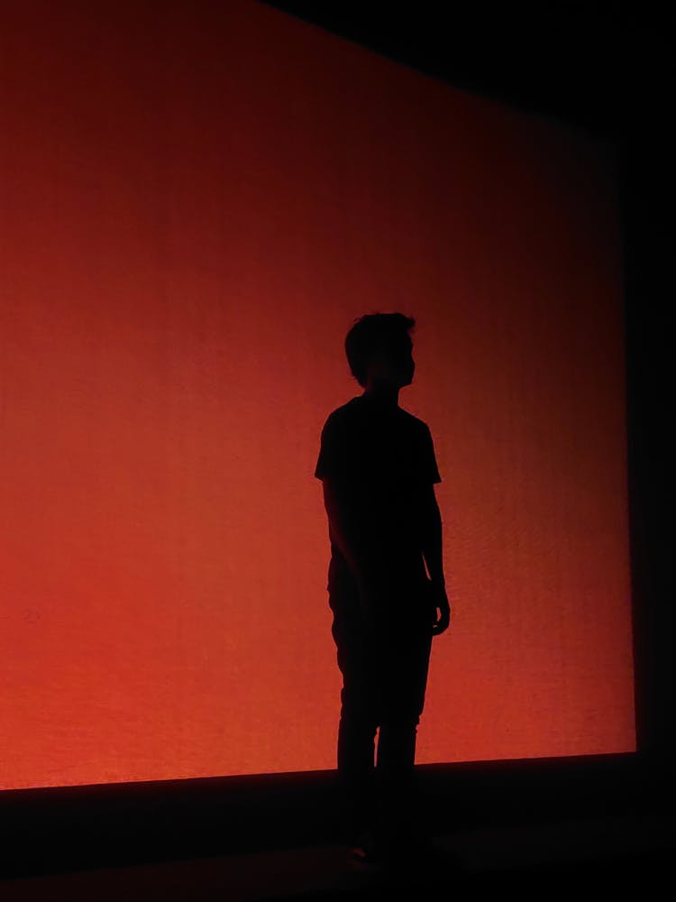 Silhouette Of Boy On Stage