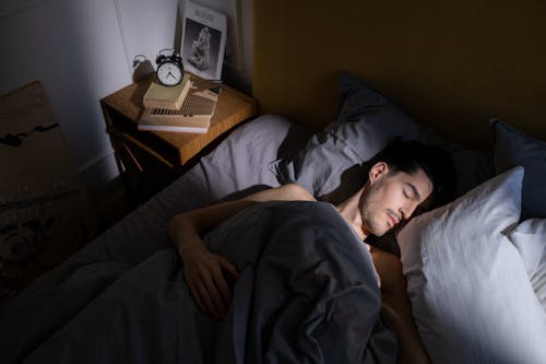 Free stock photo of adult, alarm clock, bed Stock Photo