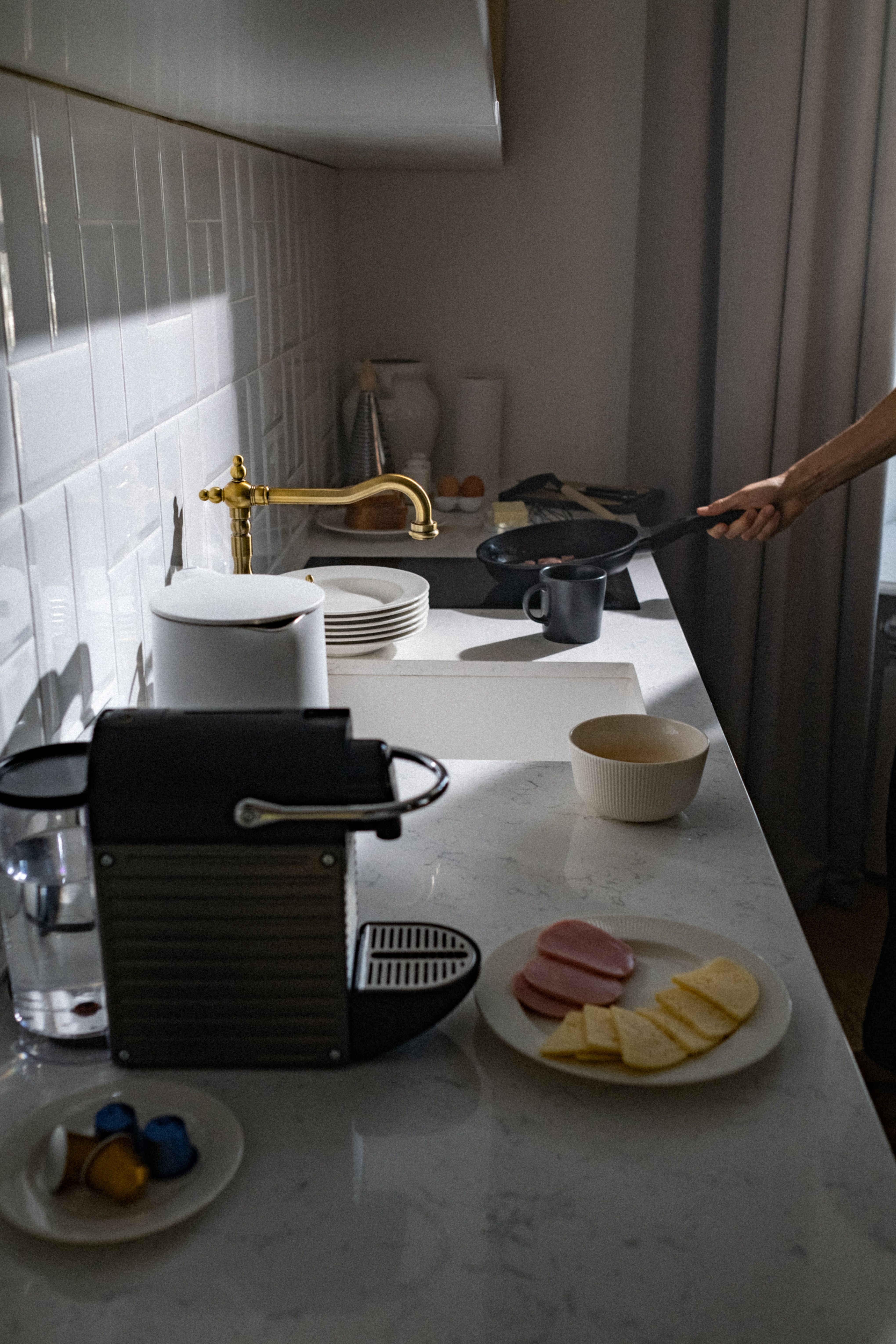 Morning coffee machine and breakfast station prepared for a compact kitchen routine