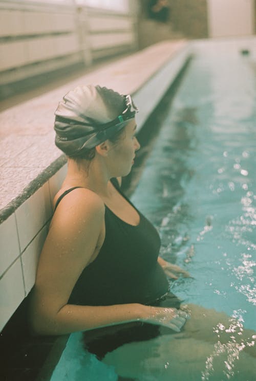 Woman in Black Swimsuit on Swimming Pool