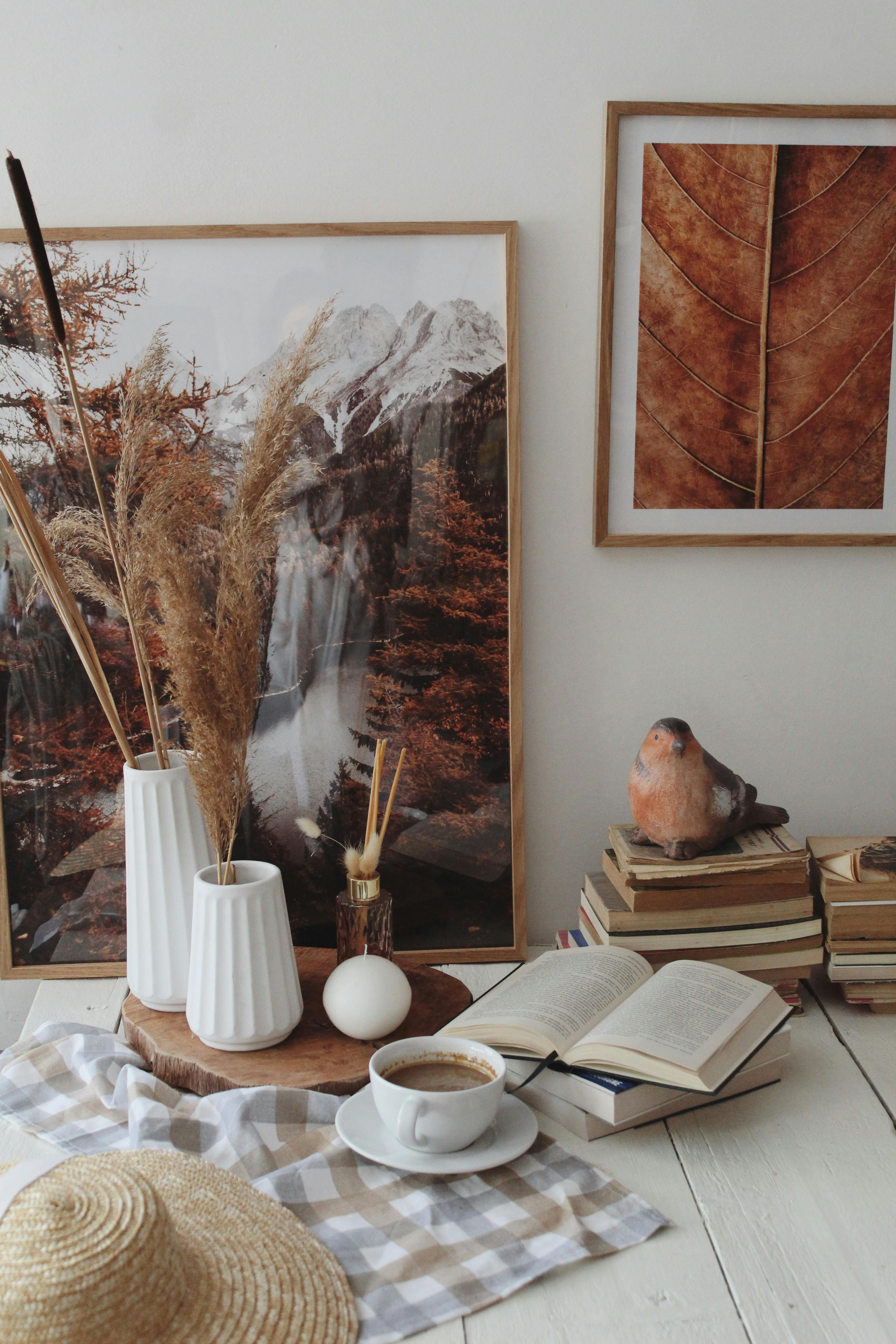 Inviting rustic interior with coffee, books, and autumn decor for a cozy feel.