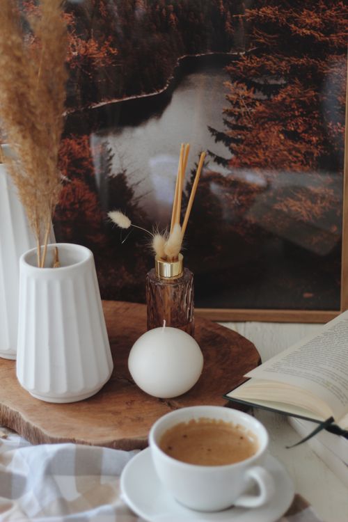Free Warm, inviting coffee scene with rustic decor and hygge aesthetic. Stock Photo
