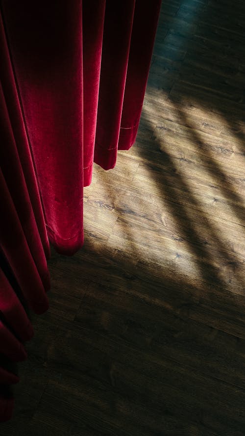 Red Curtain and Wooden Floor