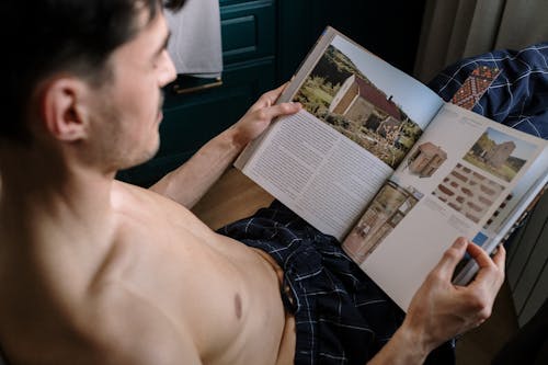 Close up on man reading book