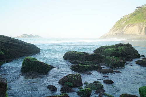 Free stock photo of early sunrise, rocky shore
