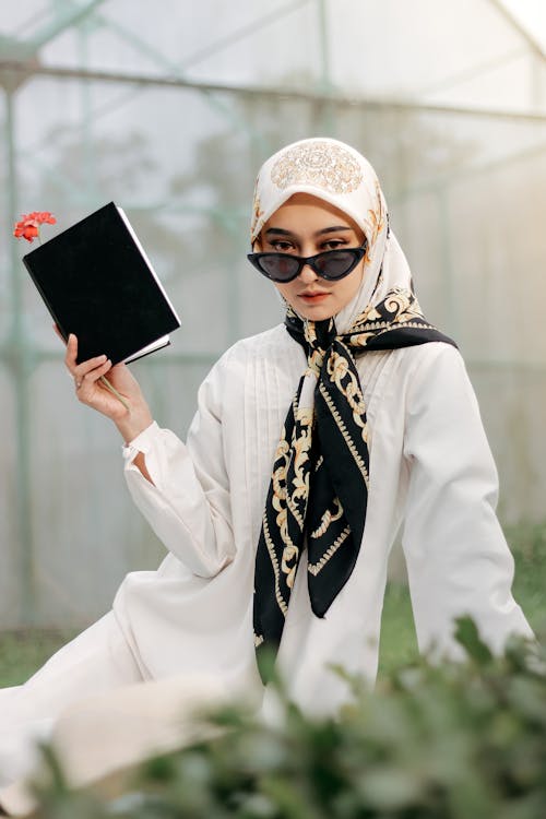 Free Woman in White Long Sleeve Shirt Holding White Tablet Computer Stock Photo