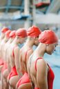Swimmers Wearing Red Swimsuits
