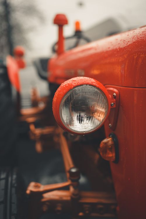 Free Detailed view of a classic red tractor headlight with raindrops in Istanbul. Stock Photo