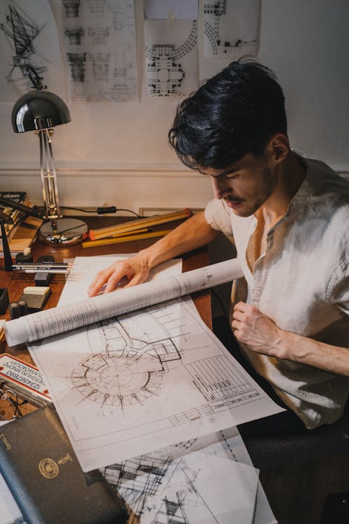 Adult man looking at drawing on deck