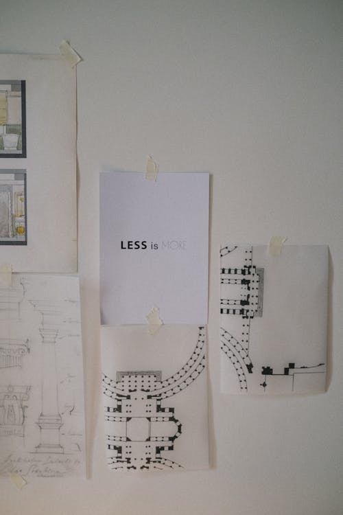Drawings and plans glued on wall