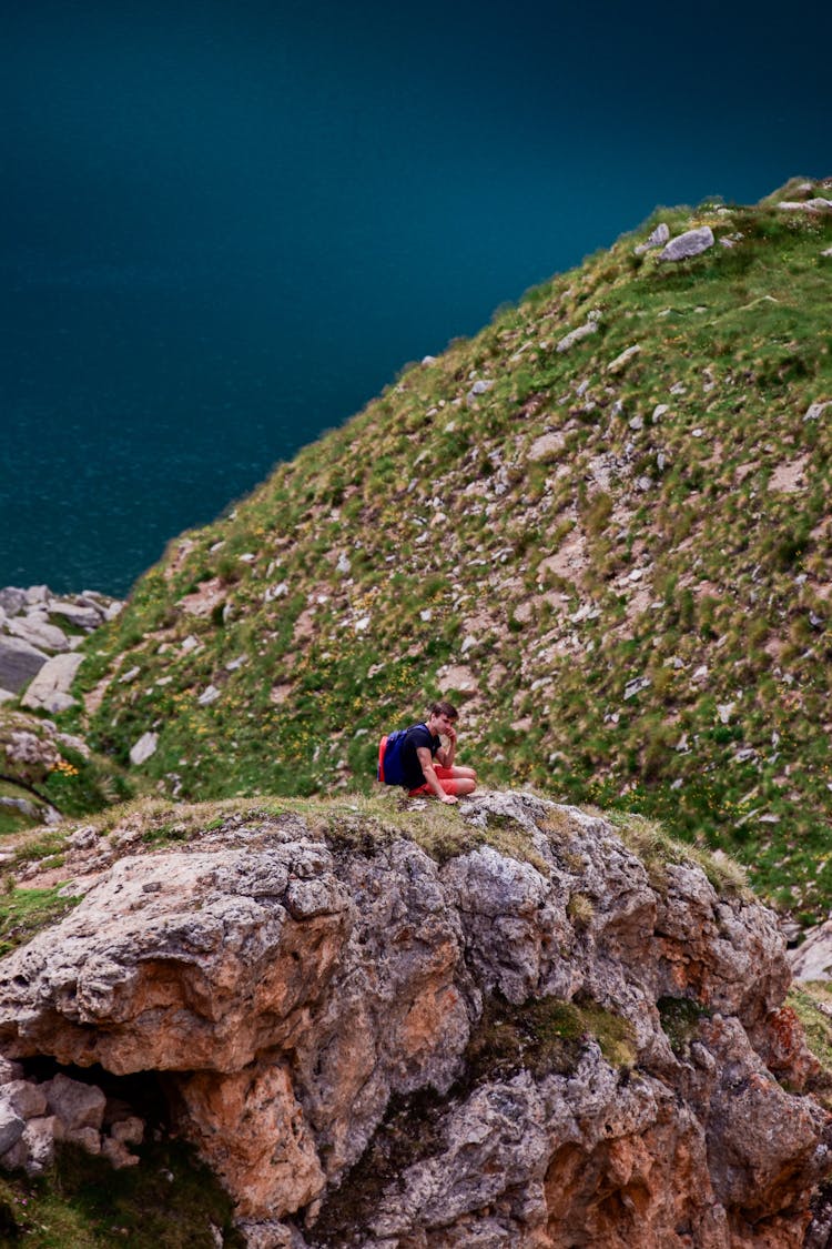 Man On Rocks On Hill