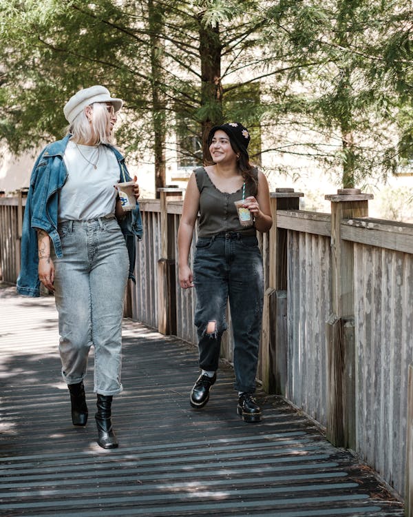 Two young girls walking and talking