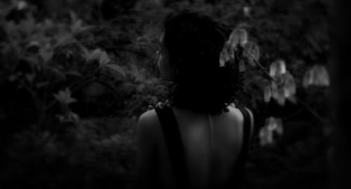 Grayscale Photography of Woman in Tank Top in the Garden