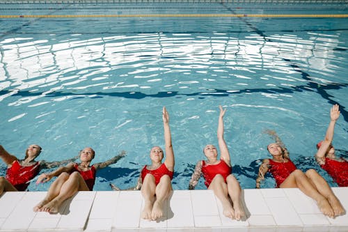 Group of Women Practicing in the Swimming Pool