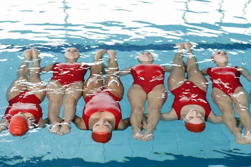 Free Girls in Red Swimsuits in Pool Stock Photo