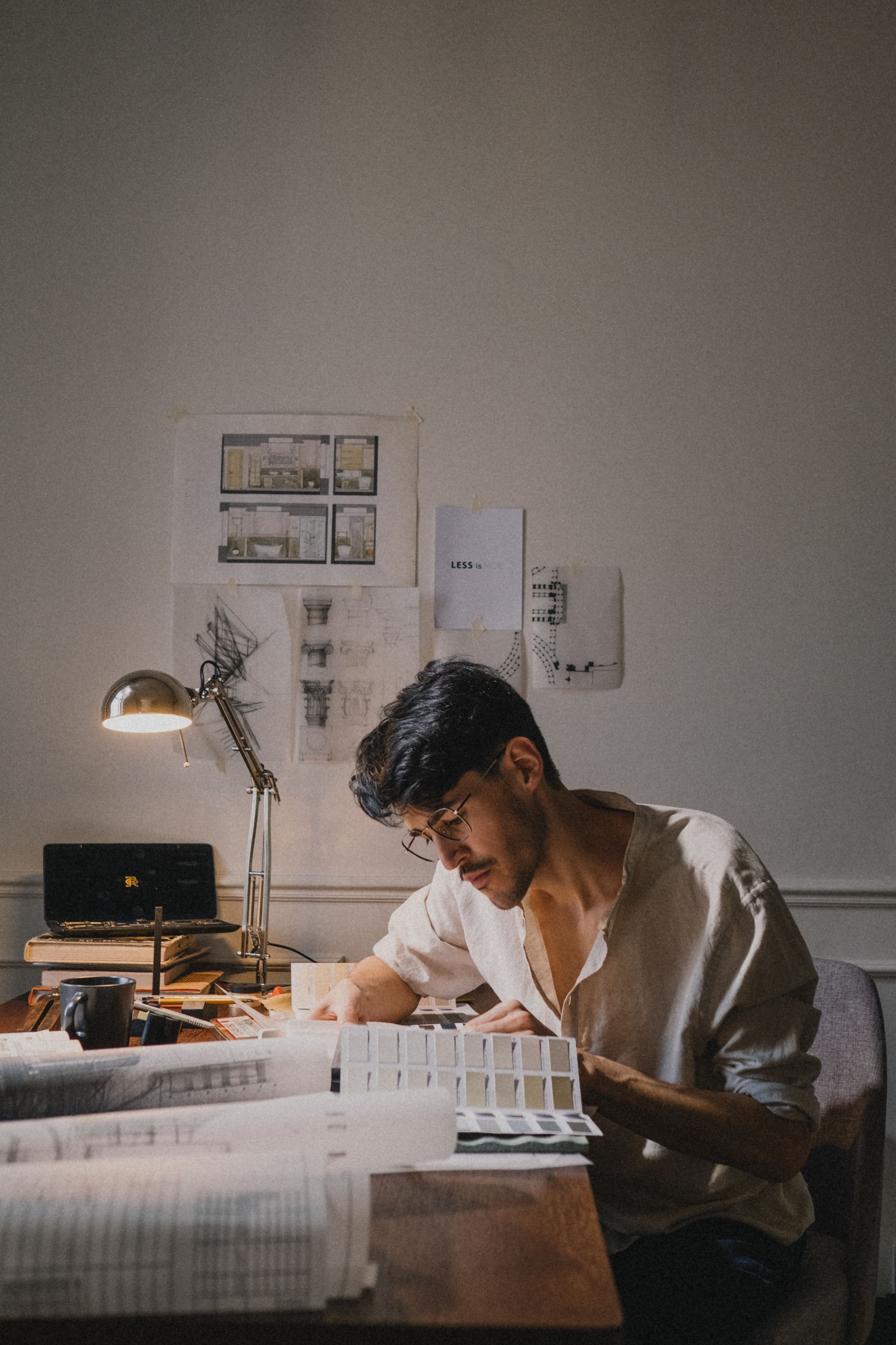 Interior designer reviewing plans and material samples