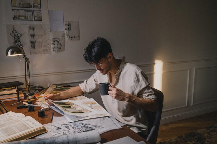 Architect Working At Home At Desk