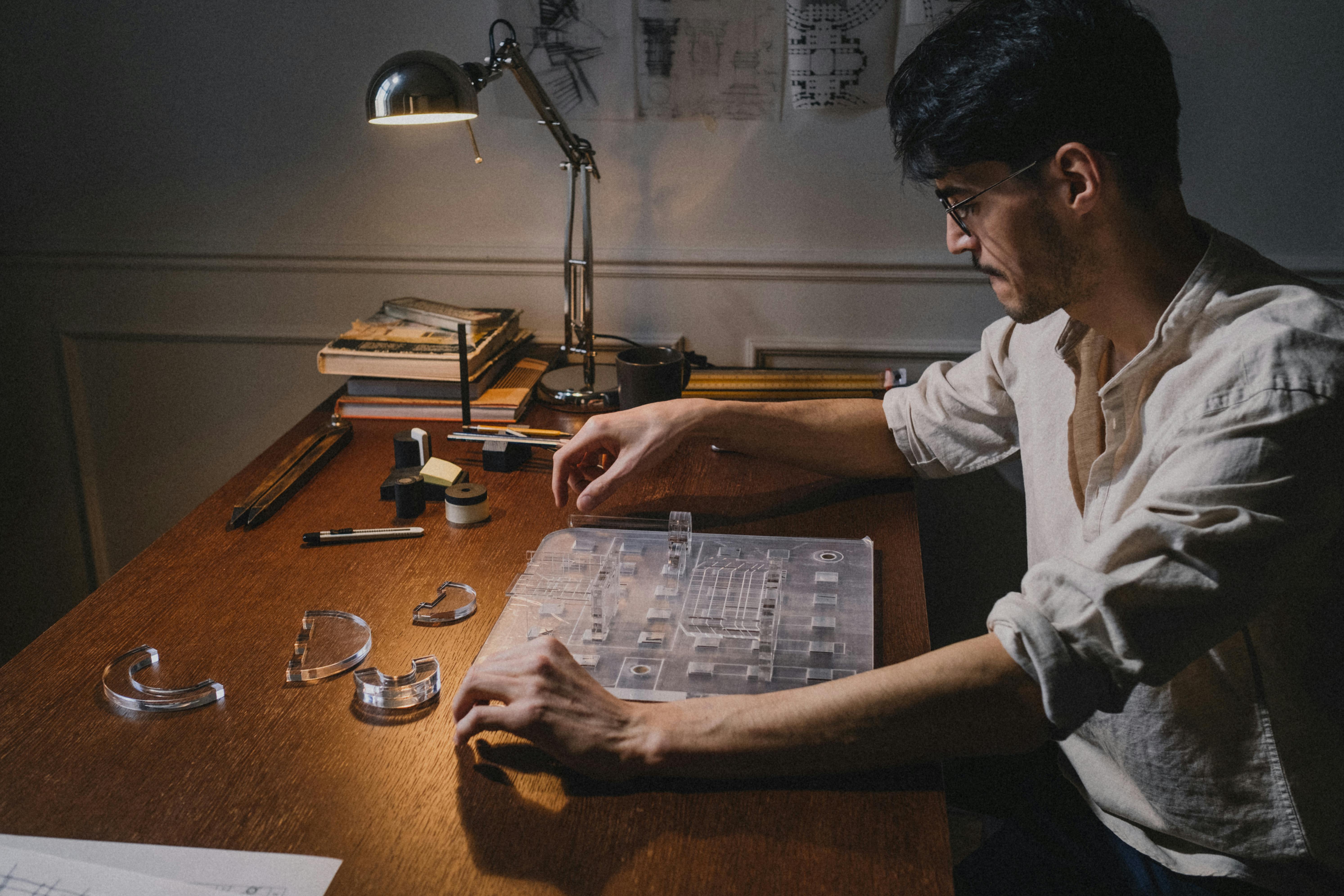 An architect working diligently on a model in a well-organized workspace, creating an innovative design.
