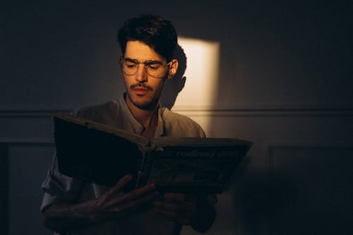 Portrait of man reading book