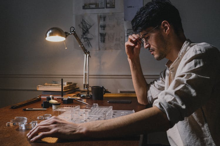 Architect Working At Home At Desk