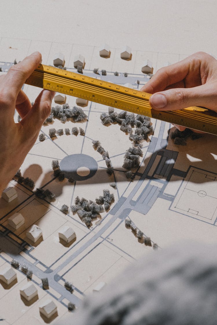 Close Up On Mans Hand Measuring A Model