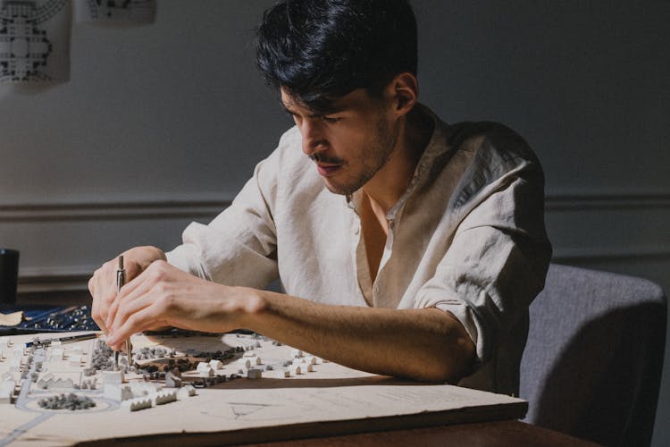 Architect Working On Model