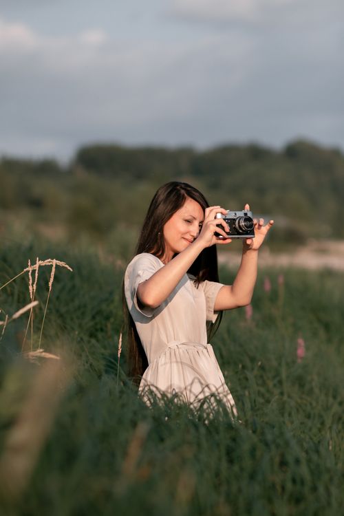 Woman Standing in the Middle of a Grass Field · Free Stock Photo