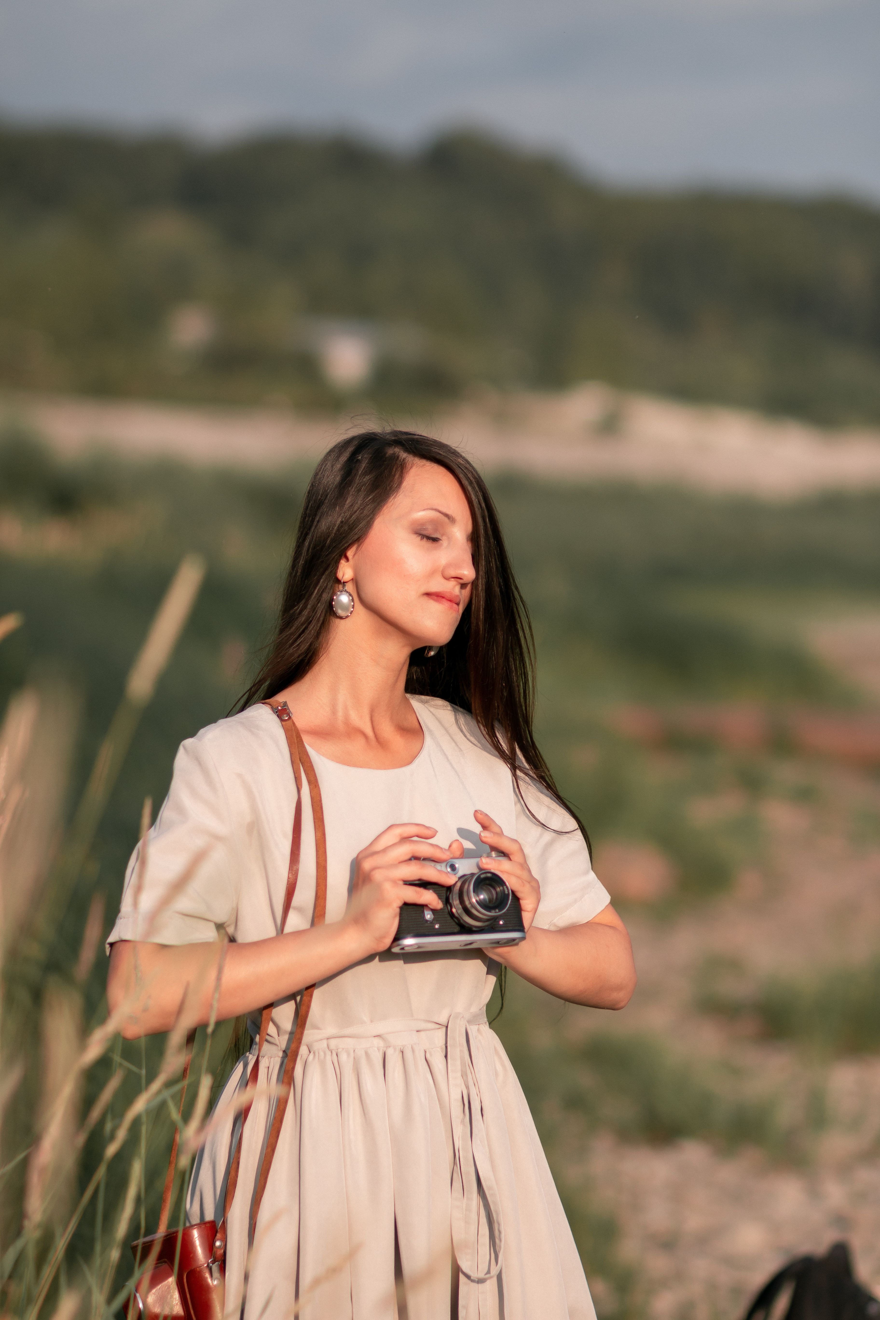 Woman Standing in the Middle of a Grass Field · Free Stock Photo