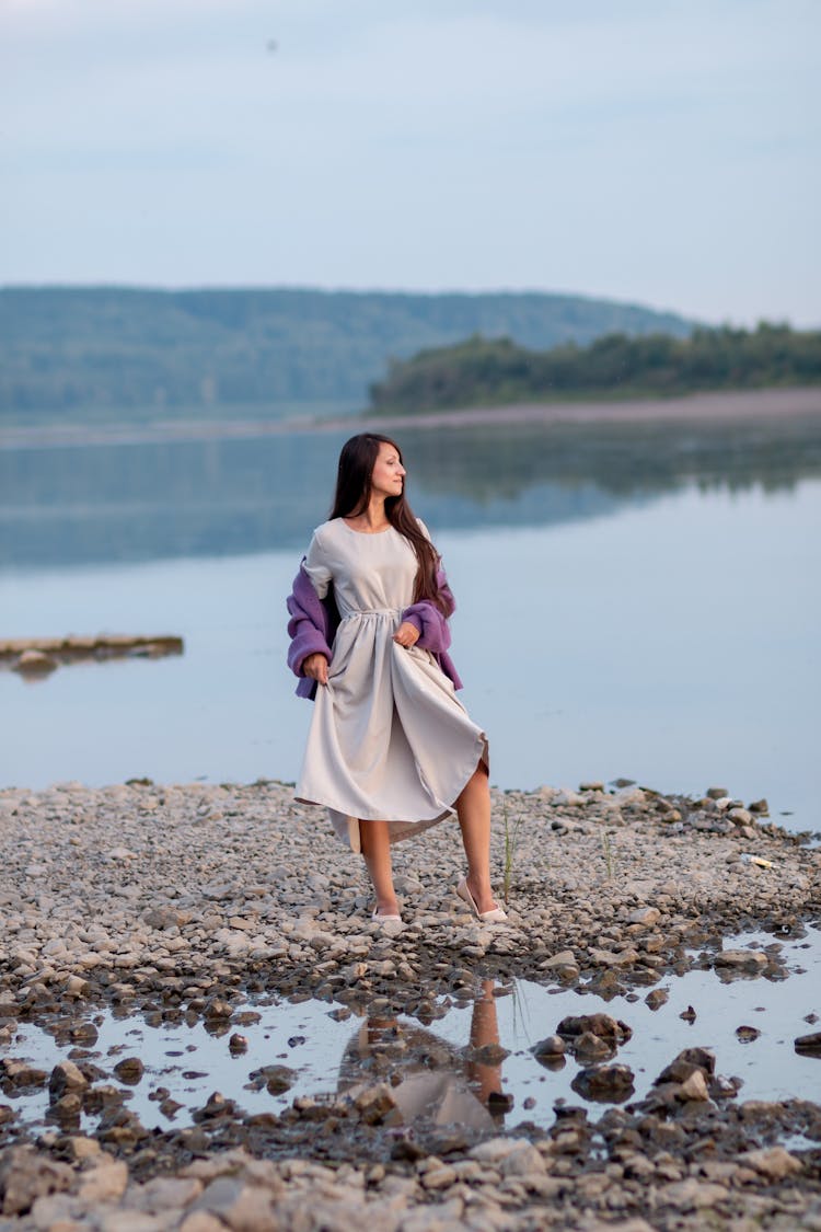 Woman In Dress On Lakeshore