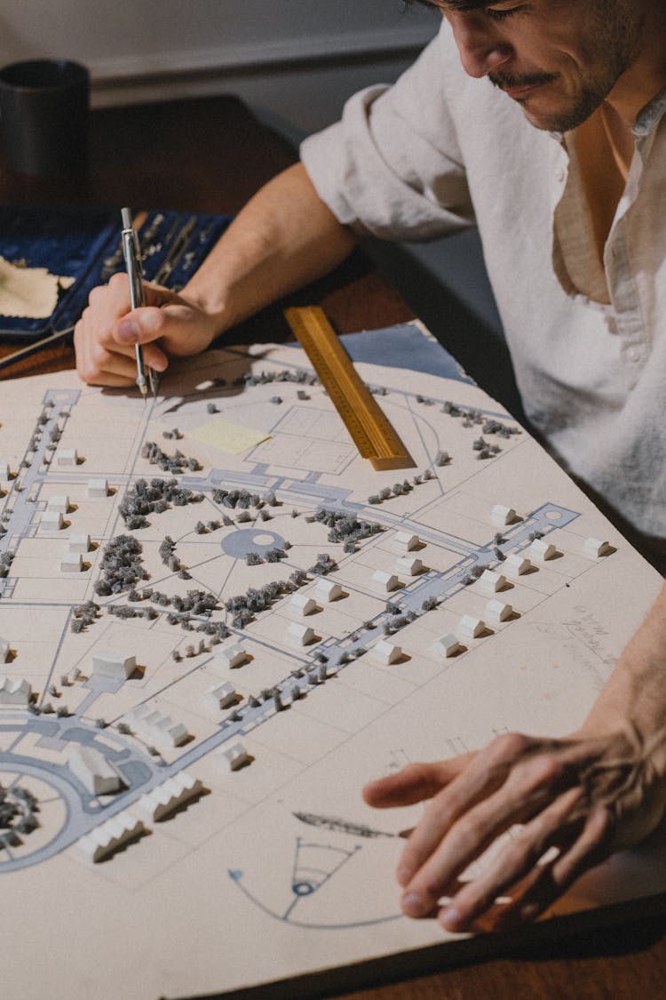 Architect Working On Architectural Model