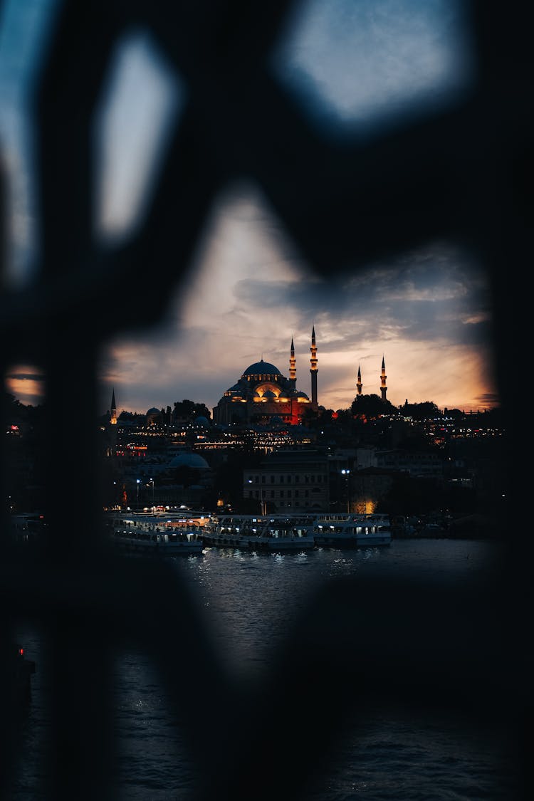 Evening View Of Mosque And Minarets Through Architectural Detail 