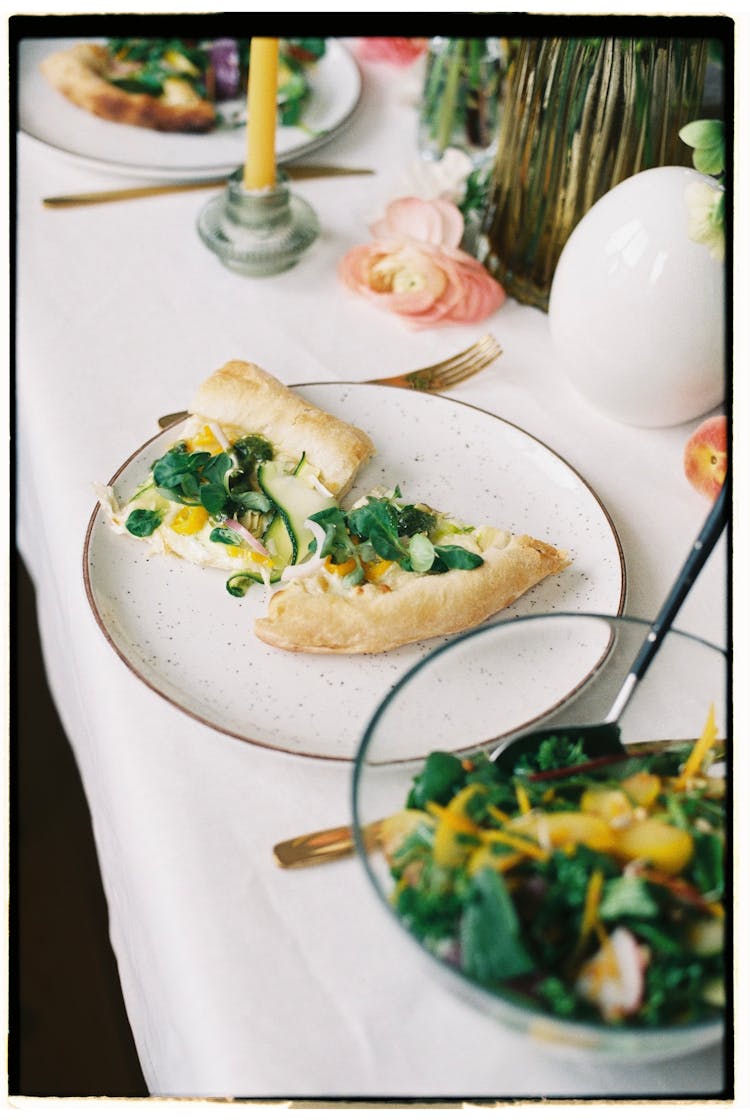 Pizza With Herbs And Salad In Bowl