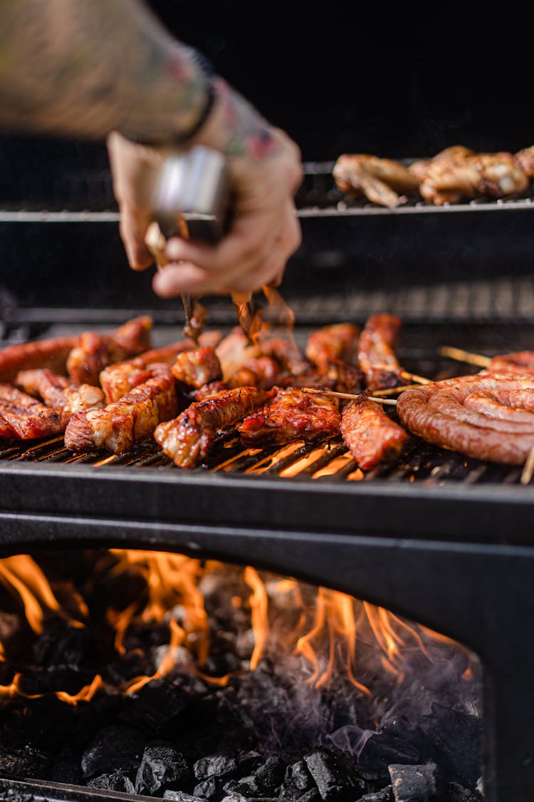 A Person Grilling Meats