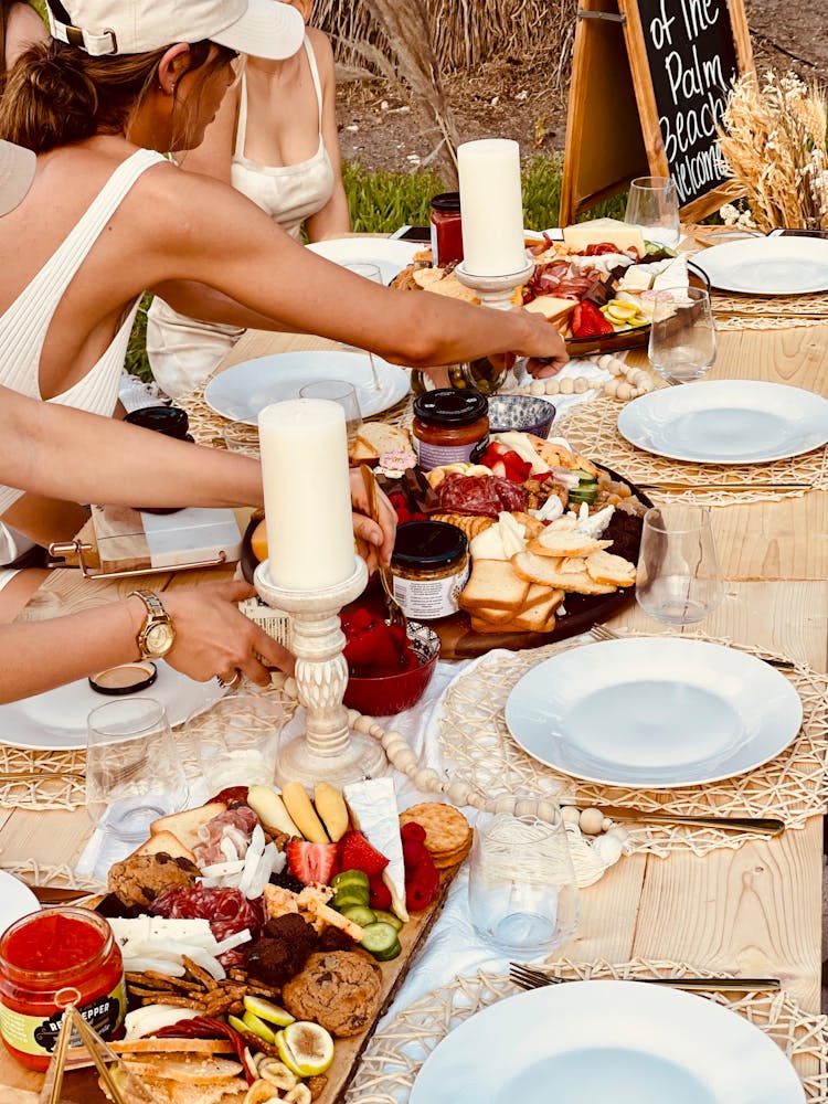 Woman And Table With Meals