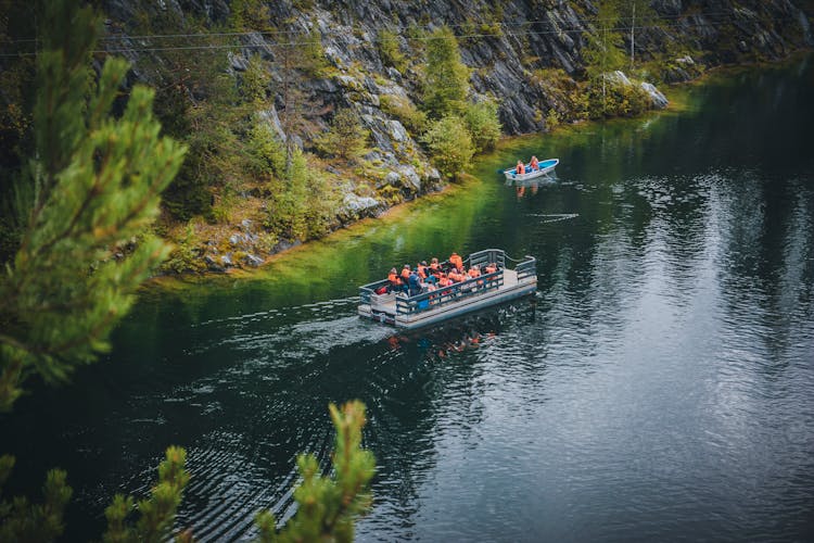 People Rafting On River