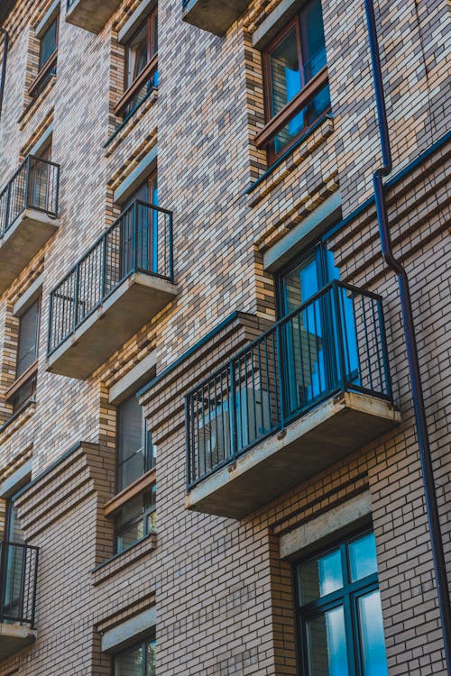  Brown and Gray Brick Building with Balconies