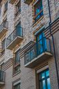 Brown and Gray Brick Building with Balconies