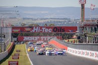 Blue and White Racing Car on Race Track