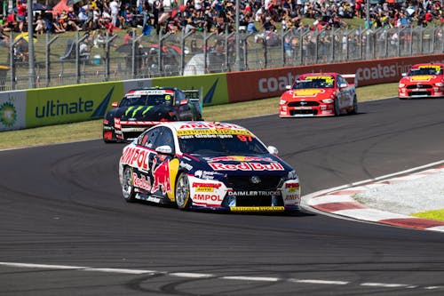 Fast Moving Racing Cars on the Track